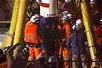 rescuers lower capsule